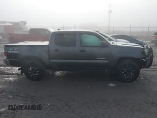 2015 Toyota Tacoma with VIN 3TMLU4EN7FM201302, listed as a IAAI auction lot 41666606 with 200,504 mi miles and . Bid and sale history available at DreamBid. Image 14.
