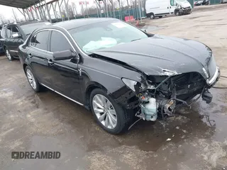 2014 Lincoln MKS with VIN 1LNHL9EK7EG609329, listed as a IAAI auction lot 41555819 with 89,849 mi miles. Bid and sale history available at carsss.com. Image 1.