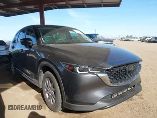 2023 Mazda CX-5 S Carbon Edition z VIN JM3KFBCM2P0196297, wystawiony jako IAAI lot #41691704 z przebiegiem 29 180 mil mil oraz . Historia ofert i sprzedaży dostępna na DreamBid. Obrazek 1.