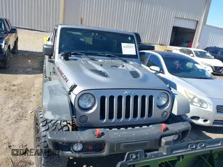 2015 Jeep Wrangler Unlimited Rubicon Hard Rock with VIN 1C4HJWFG2FL587607, listed as a IAAI auction lot 41419237 with 109,719 mi miles and . Bid and sale history available at DreamBid. Image 12.