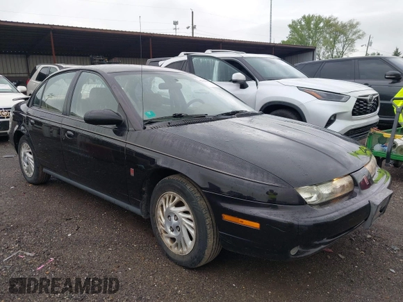 1999 Saturn SL with VIN 1G8ZK5272XZ263163, listed as a IAAI auction lot 42180002 with 138,463 mi miles. Bid and sale history available at carsss.com. Image 1.
