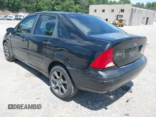 2004 Ford Focus SE z VIN 1FAFP34Z54W175689, wystawiony jako IAAI lot #42553615 z przebiegiem 188 652 mil mil oraz . Historia ofert i sprzedaży dostępna na DreamBid. Obrazek 3.