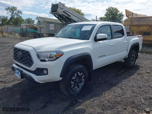 2021 Toyota Tacoma 4WD SR with VIN 3TMCZ5AN8MM424104, listed as a IAAI auction lot 40581284 with 74,706 mi miles. Bid and sale history available at carsss.com. Image 2.