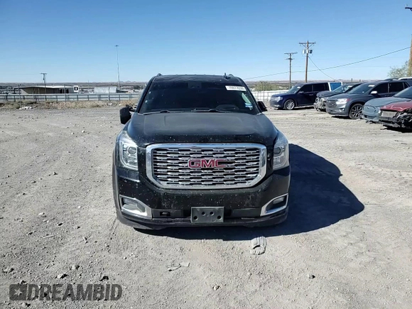 2018 GMC Yukon Denali with VIN 1GKS1CKJ0JR106589, listed as a Copart auction lot 79977034 with 98,022 mi miles and Salvage Title. Bid and sale history available at carsss.com. Image 12.