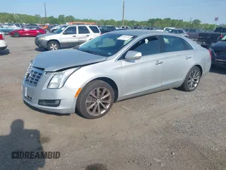 2013 Cadillac XTS with VIN 2G61N5S31D9135710, listed as a IAAI auction lot 42002480 with 162,029 mi miles. Bid and sale history available at carsss.com. Image 2.