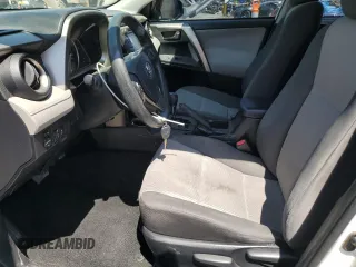 2014 Toyota RAV4 LE with VIN JTMZFREV7EJ018804, listed as a Copart auction lot 62738795 with 97,265 mi miles and Salvage title. Bid and sale history available at DreamBid. Image 7.