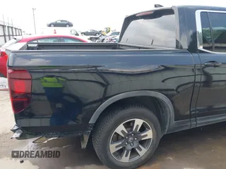 2017 Honda Ridgeline RTL z VIN 5FPYK2F55HB011463, wystawiony jako IAAI lot #42139030 z przebiegiem 59 066 mil mil oraz . Historia ofert i sprzedaży dostępna na DreamBid. Obrazek 22.