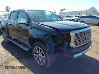 2018 GMC Canyon 4WD Denali z VIN 1GTG6EEN6J1164542, wystawiony jako IAAI lot #42237387 z przebiegiem 128 824 mil mil oraz . Historia ofert i sprzedaży dostępna na DreamBid. Obrazek 1.