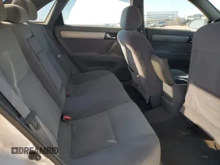 2006 Suzuki Forenza Premium z VIN KL5JJ56Z36K268290, wystawiony jako Copart lot #88509495 z przebiegiem 199 303 mil mil oraz Szkody całkowita. Historia ofert i sprzedaży dostępna na DreamBid. Obrazek 11.
