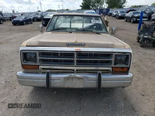 1987 Dodge Trucks z VIN 1B7HD14TXHS334781, wystawiony jako Copart lot #69347244 z przebiegiem 69 244 mil mil oraz Szkody całkowita. Historia ofert i sprzedaży dostępna na DreamBid. Obrazek 5.