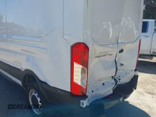 2022 Ford Transit Cargo with VIN 1FTBR1C84NKA76483, listed as a IAAI auction lot 40365786 with 28,854 mi miles and . Bid and sale history available at DreamBid. Image 17.