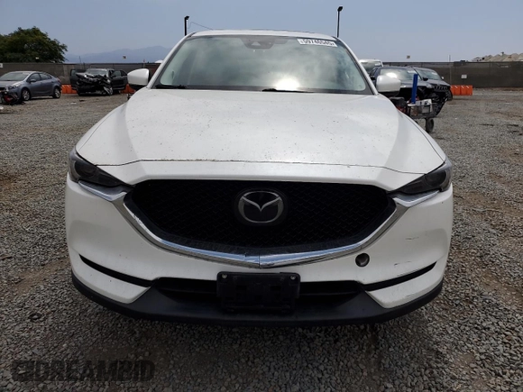 2018 Mazda CX-5 Grand Touring with VIN JM3KFADMXJ1358221, listed as a Copart auction lot 59746545 with 54,094 mi miles and Salvage title. Bid and sale history available at DreamBid. Image 5.