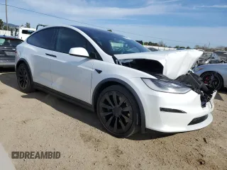 2022 Tesla Model X with VIN 7SAXCBE5XNF358319, listed as a Copart auction lot 50246555 with 12,863 mi miles and Salvage Title. Bid and sale history available at DreamBid. Image 4.