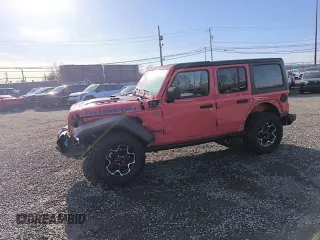 2023 Jeep Wrangler Rubicon z VIN 1C4JJXR69PW695846, wystawiony jako Copart lot #57472885 z przebiegiem 17 239 mil mil oraz Czysty tytuł • Clean title. Historia ofert i sprzedaży dostępna na DreamBid. Obrazek 1.