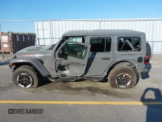 2020 Jeep Wrangler Unlimited Rubicon with VIN 1C4HJXFN4LW136516, listed as a IAAI auction lot 41874403 with 87,576 mi miles. Bid and sale history available at carsss.com. Image 14.