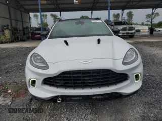 2021 Aston Martin DBX z VIN SCFVUJAW8MTV01405, wystawiony jako Copart lot #56564704 z przebiegiem 12 386 mil mil oraz Szkody całkowita. Historia ofert i sprzedaży dostępna na DreamBid. Obrazek 5.