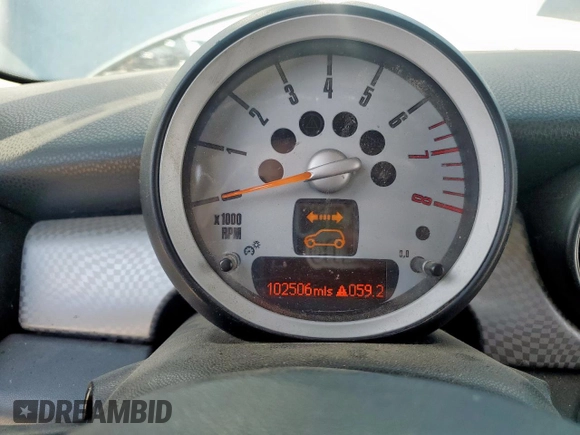 2010 MINI Hardtop S with VIN WMWMF7C51ATZ69061, listed as a Copart auction lot 60837465 with 102,506 mi miles and Salvage title. Bid and sale history available at DreamBid. Image 9.