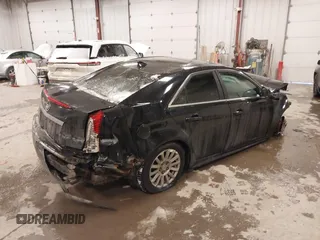 2010 Cadillac CTS with VIN 1G6DA5EG0A0110892, listed as a IAAI auction lot 41321333 with 112,851 mi miles and . Bid and sale history available at DreamBid. Image 4.