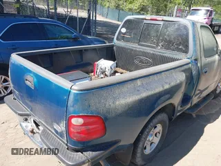 2000 Ford F-150 XL with VIN 1FTZF0722YKB38958, listed as a IAAI auction lot 42050827 with 235,315 mi miles. Bid and sale history available at carsss.com. Image 8.