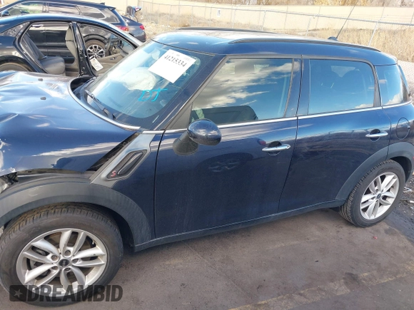 2013 MINI Countryman S with VIN WMWZC3C52DWP21475, listed as a IAAI auction lot 41215334 with 124,365 mi miles and . Bid and sale history available at DreamBid. Image 15.