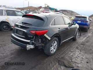 2015 Infiniti QX70 with VIN JN8CS1MW2FM480768, listed as a IAAI auction lot 41229824 with 149,146 mi miles and . Bid and sale history available at DreamBid. Image 4.