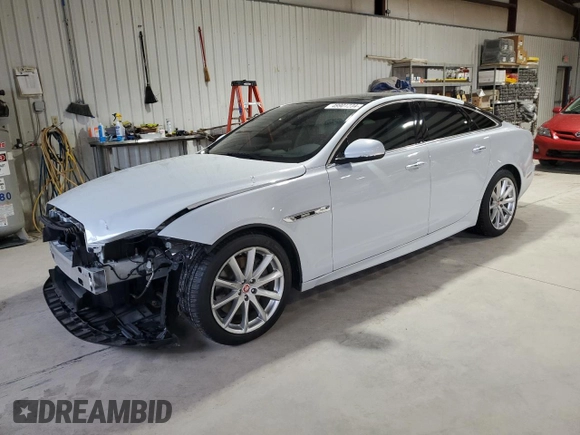 2016 Jaguar XJ R-Sport with VIN SAJWJ1CDXG8W00145, listed as a Copart auction lot 49901234 with 76,629 mi miles and . Bid and sale history available at DreamBid. Image 1.