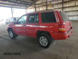 1998 Jeep Grand Cherokee Limited with VIN 1J4GZ78Y0WC294461, listed as a Copart auction lot 69477664 with 209,295 mi miles and Clean Title. Bid and sale history available at carsss.com. Image 2.