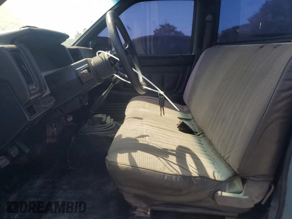 1990 Nissan Frontier with VIN 1N6SD11S9LC321876, listed as a Copart auction lot 59913575 with 119,909 mi miles and Salvage title. Bid and sale history available at DreamBid. Image 7.