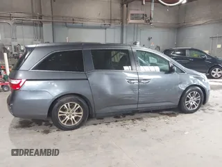 2012 Honda Odyssey EX-L with VIN 5FNRL5H63CB137198, listed as a IAAI auction lot 42706690 with 305,753 mi miles and . Bid and sale history available at DreamBid. Image 13.