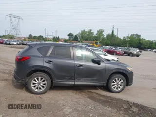 2014 Mazda CX-5 Touring z VIN JM3KE4CY2E0348500, wystawiony jako IAAI lot #42318155 z przebiegiem 182 616 mil mil oraz . Historia ofert i sprzedaży dostępna na DreamBid. Obrazek 13.