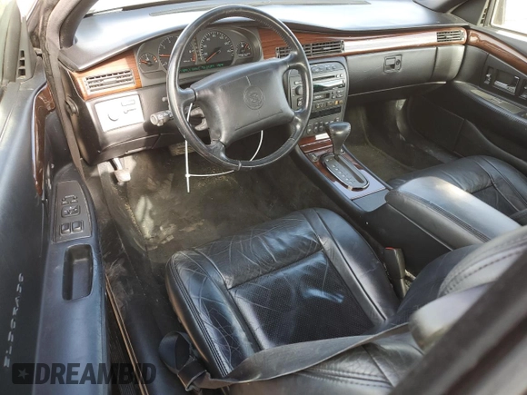 1999 Cadillac Eldorado Touring z VIN 1G6ET1298XU602343, wystawiony jako Copart lot #44327195 z przebiegiem 52 327 mil mil oraz Szkody całkowita. Historia ofert i sprzedaży dostępna na DreamBid. Obrazek 8.