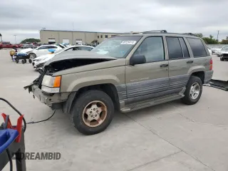 1998 Jeep Grand Cherokee Laredo with VIN 1J4FX58S0WC337066, listed as a Copart auction lot 69125414 with 0 mi miles and Salvage Title. Bid and sale history available at carsss.com. Image 1.