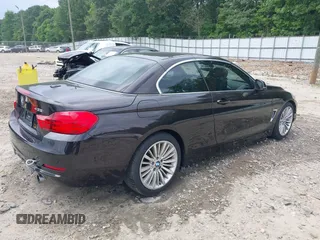 2014 BMW 4 Series 435i with VIN WBA3T3C50EJ876997, listed as a IAAI auction lot 42406299 with 115,048 mi miles and . Bid and sale history available at DreamBid. Image 4.