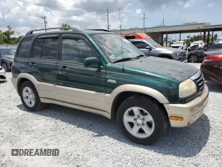 2002 Suzuki Grand Vitara JS z VIN JS3TE62V924151538, wystawiony jako Copart lot #58900085 z przebiegiem 130 514 mil mil oraz Szkoda całkowita • Salvage title. Historia ofert i sprzedaży dostępna na DreamBid. Obrazek 4.