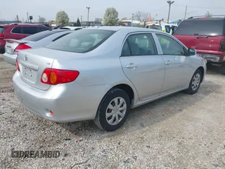 2009 Toyota Corolla with VIN JTDBL40EX9J029628, listed as a IAAI auction lot 42111711 with 168,226 mi miles. Bid and sale history available at carsss.com. Image 4.