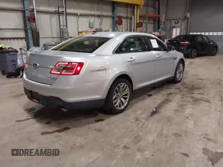 2013 Ford Taurus Limited with VIN 1FAHP2F83DG116657, listed as a IAAI auction lot 41533075 with 124,649 mi miles. Bid and sale history available at carsss.com. Image 4.