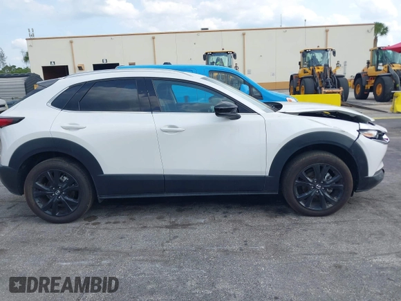 2024 Mazda CX-30 Premium z VIN 3MVDMBDY7RM706554, wystawiony jako IAAI lot #42322863 z przebiegiem 2817 mil mil oraz . Historia ofert i sprzedaży dostępna na DreamBid. Obrazek 13.
