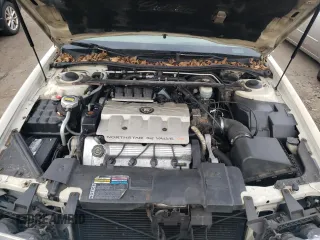 1999 Cadillac Eldorado z VIN 1G6EL12Y5XU600699, wystawiony jako Copart lot #88164505 z przebiegiem 140 075 mil mil oraz Szkoda całkowita • Salvage title. Historia ofert i sprzedaży dostępna na DreamBid. Obrazek 11.