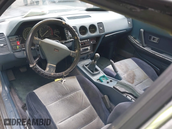 1987 Nissan 300ZX z VIN JN1HZ14S6HX217908, wystawiony jako IAAI lot #42271417 z przebiegiem 195 466 mil mil oraz . Historia ofert i sprzedaży dostępna na DreamBid. Obrazek 5.