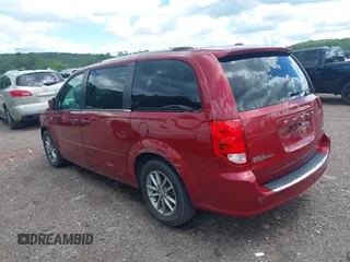 2014 Dodge Grand Caravan SXT with VIN 2C4RDGCG4ER366537, listed as a IAAI auction lot 42148032 with 126,531 mi miles and . Bid and sale history available at DreamBid. Image 3.