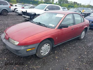 1997 Saturn SL with VIN 1G8ZF5289VZ138039, listed as a IAAI auction lot 39432871 with 125,022 mi miles. Bid and sale history available at carsss.com. Image 2.