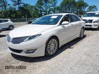 2014 Lincoln MKZ z VIN 3LN6L2GK6ER817934, wystawiony jako IAAI lot #42320672 z przebiegiem 103 710 mil mil oraz . Historia ofert i sprzedaży dostępna na DreamBid. Obrazek 2.