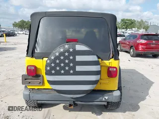 2002 Jeep Wrangler X z VIN 1J4FA39S82P719241, wystawiony jako IAAI lot #42150742 z przebiegiem 147 914 mil mil oraz . Historia ofert i sprzedaży dostępna na DreamBid. Obrazek 16.