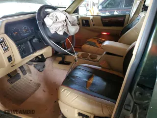 1995 Jeep Grand Cherokee Limited with VIN 1J4GZ78Y2SC723898, listed as a Copart auction lot 54142035 with 173,454 mi miles and Salvage Title. Bid and sale history available at carsss.com. Image 7.