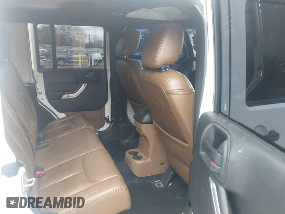 2014 Jeep Wrangler Unlimited Sahara z VIN 1C4BJWEG6EL245986, wystawiony jako IAAI lot #41498492 z przebiegiem 125 882 mil mil oraz . Historia ofert i sprzedaży dostępna na DreamBid. Obrazek 8.