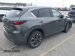 2022 Mazda CX-5 2.5 S Premium Plus Package with VIN JM3KFBEM1N0523105, listed as a IAAI auction lot 41730897 with 64,008 mi miles. Bid and sale history available at carsss.com. Image 4.