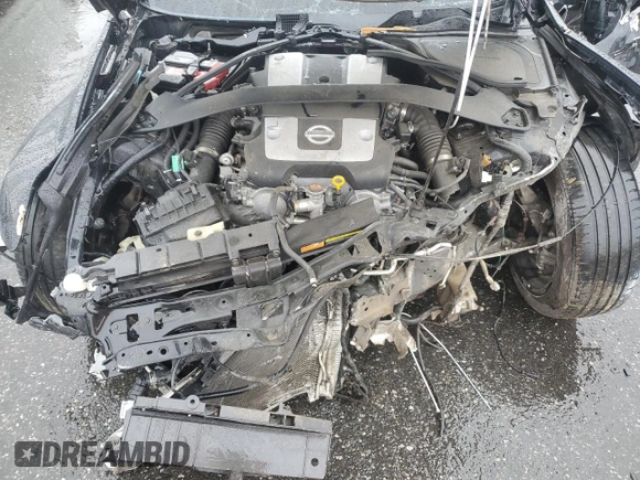 2017 Nissan 370Z z VIN JN1AZ4EH7HM952775, wystawiony jako Copart lot #81940704 z przebiegiem Nie podano mil oraz Szkoda całkowita • Salvage title. Historia ofert i sprzedaży dostępna na DreamBid. Obrazek 11.