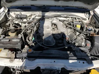 2002 Nissan Frontier SC z VIN 1N6MD29Y52C369414, wystawiony jako Copart lot #58532505 z przebiegiem 249 926 mil mil oraz Szkoda całkowita • Salvage title. Historia ofert i sprzedaży dostępna na DreamBid. Obrazek 11.
