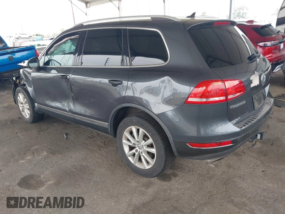2014 Volkswagen Touareg Sport with VIN WVGEF9BP0ED015273, listed as a IAAI auction lot 42046823 with 84,694 mi miles and . Bid and sale history available at DreamBid. Image 3.