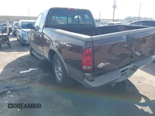 2002 Ford F-150 XL with VIN 1FTRX17L82KB68307, listed as a IAAI auction lot 40642958 with 115,737 mi miles. Bid and sale history available at carsss.com. Image 3.